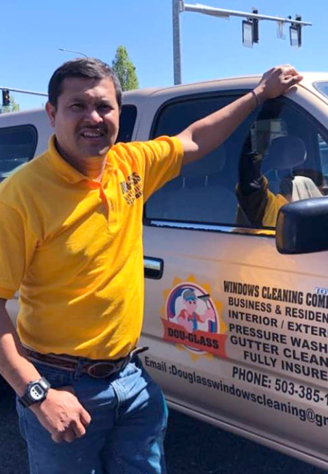 Dou-Glass owner standing proudly by branded work van in Keizer, Oregon – family-owned professional window cleaning, pressure washing, and exterior services