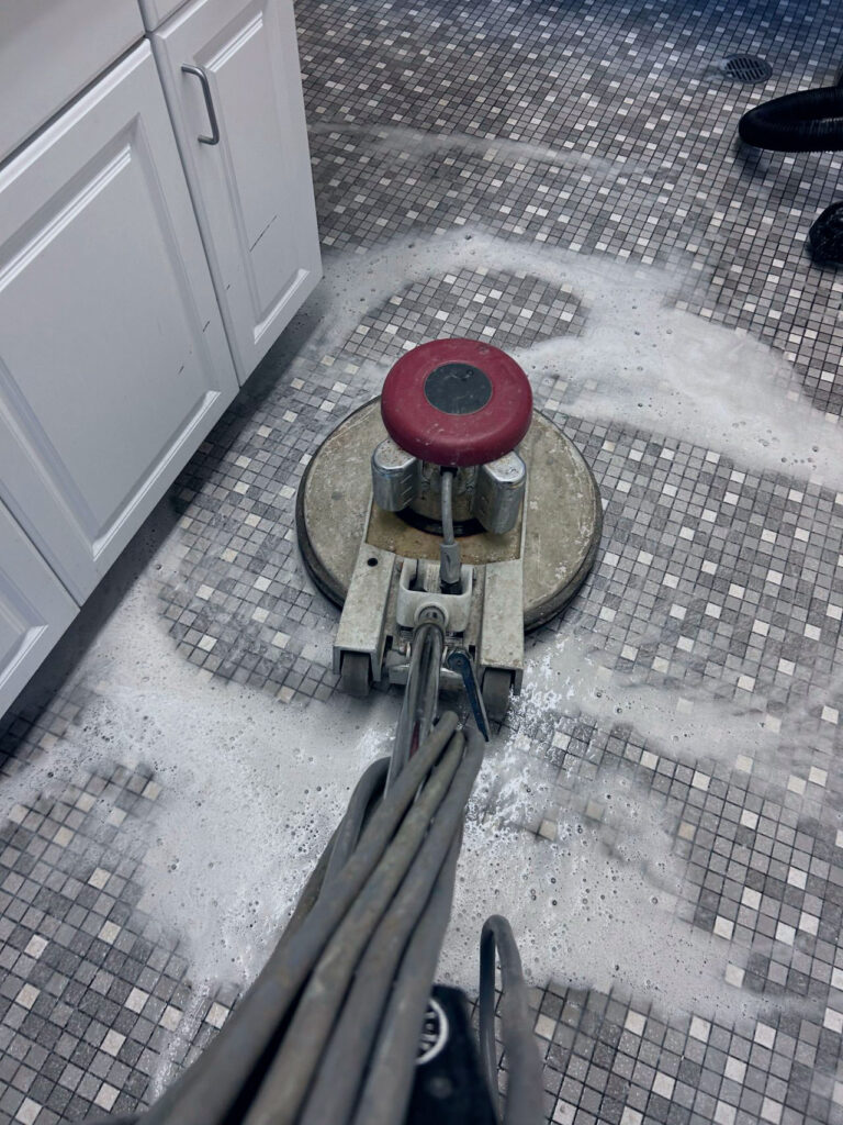 Professional floor waxing and polishing machine cleaning mosaic tile floor in Keizer, Oregon – restore shine and protection with Dou-Glass interior services